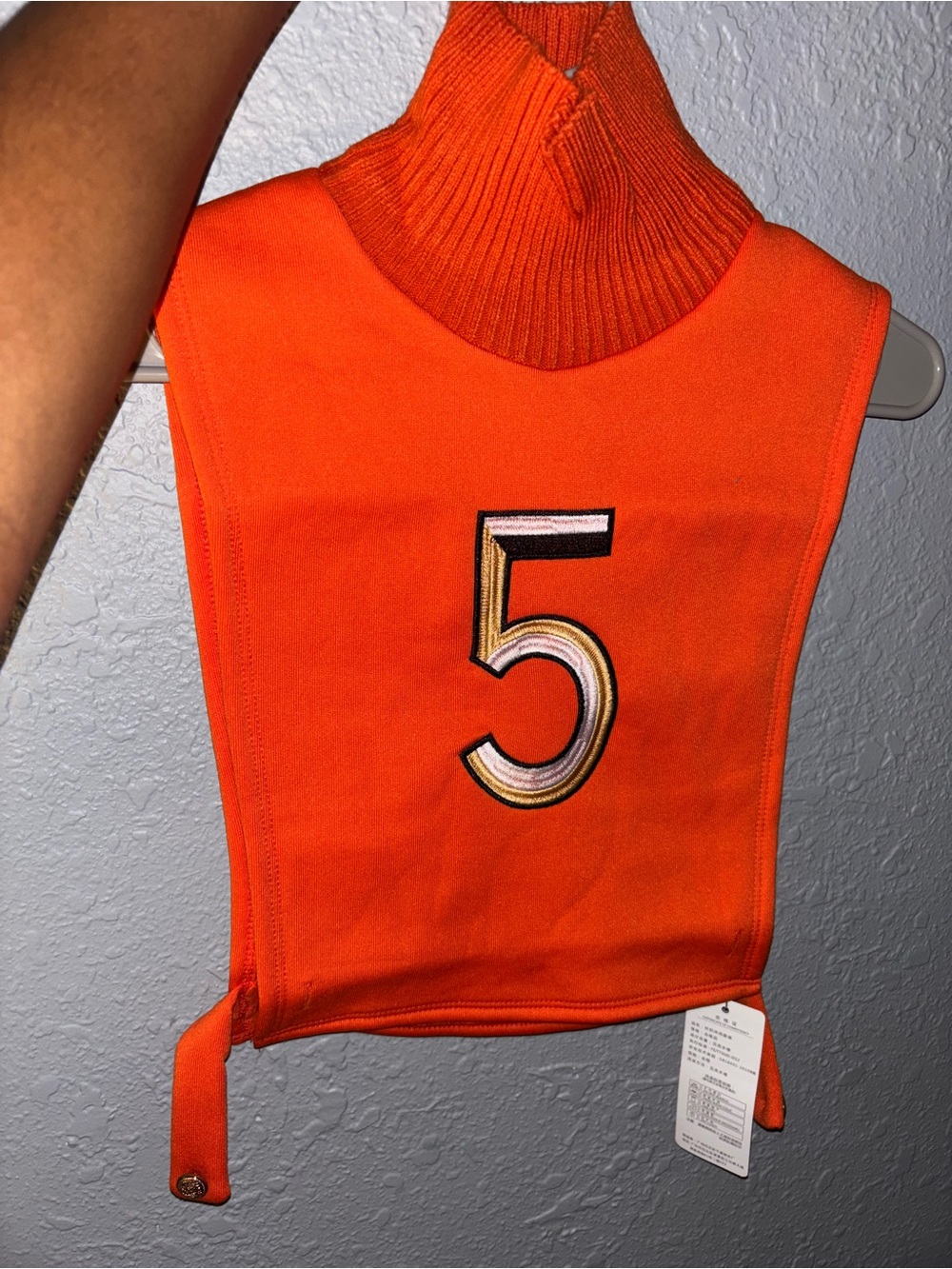 Sleeveless Orange Turtleneck Sweater Bib with Number 5